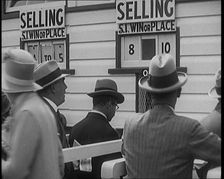 A Crowd of People Standing Outside a Totaliser/Tote Office at a Horse Race Course..., 1929. Creator: British Pathe Ltd