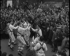 A Crowd of People Watching Morris Dancers Perform, 1931. Creator: British Pathe Ltd