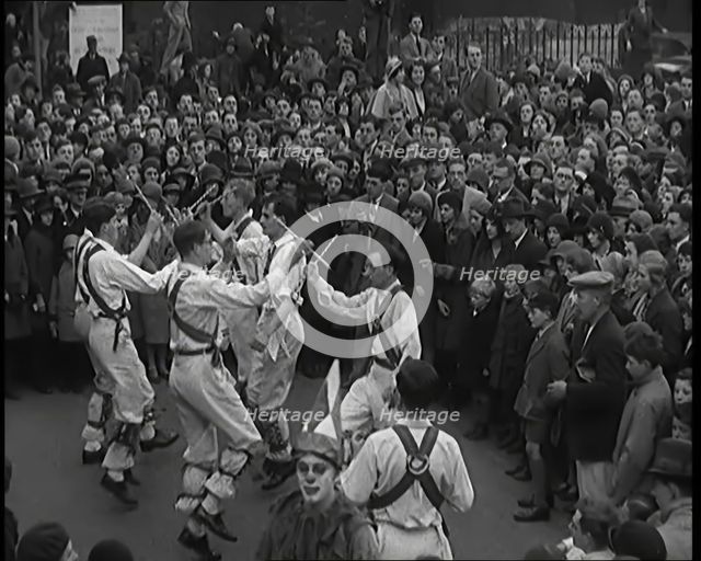 A Crowd of People Watching Morris Dancers Perform, 1931. Creator: British Pathe Ltd.