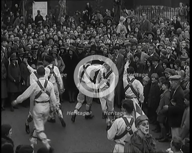 A Crowd of People Watching Morris Dancers Perform, 1931. Creator: British Pathe Ltd.