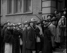 A Crowd of People Waiting an Unemployment Queue, 1924. Creator: British Pathe Ltd