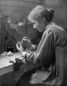 A craftswoman at work, 1911-1912.Artist: ET Holding