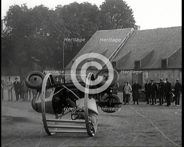 A Crashable Car With a Circular Frame Allowing It To Roll Over Being Tested in Front of..., 1926. Creator: British Pathe Ltd.