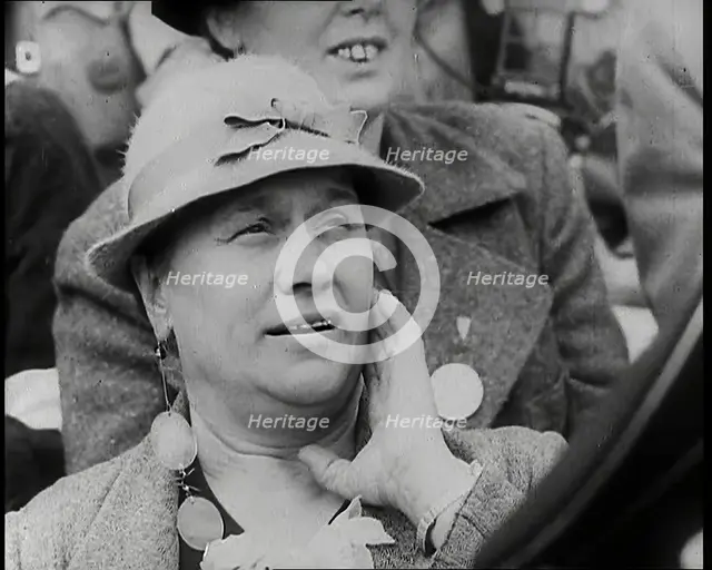 A Czech Woman in a Crowd in a Street Holding Her Left Hand up to Her Face, 1939. Creator: British Pathe Ltd.