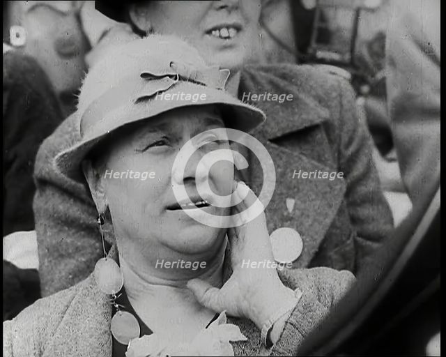 A Czech Woman in a Crowd in a Street Holding Her Left Hand up to Her Face, 1939. Creator: British Pathe Ltd.
