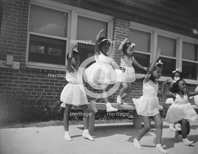 A dance group, Frederick Douglass housing project,Anacostia, D.C., 1942. Creator: Gordon Parks.