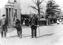 A dancing bear and owner performing outside an inn, Oxfordshire, c1900. Artist: Henry Taunt
