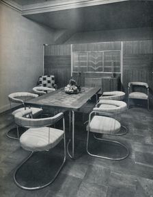 A dining-room suite, with table and chairs of steel tube. By Practical Equipment Ltd., of London