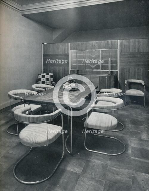 'A dining-room suite, with table and chairs of steel tube. By Practical Equipment Ltd., of London',  Artist: Unknown.
