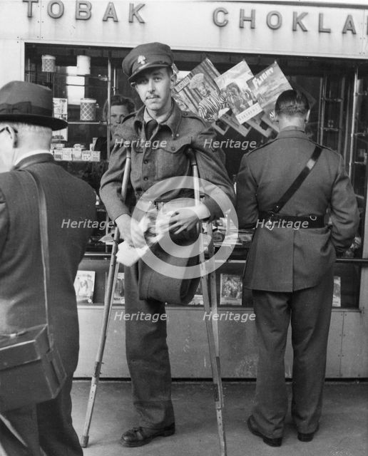 A disabled WWII Allied POW on his way home, Trelleborg railway station, Sweden, 1943. Artist: Unknown