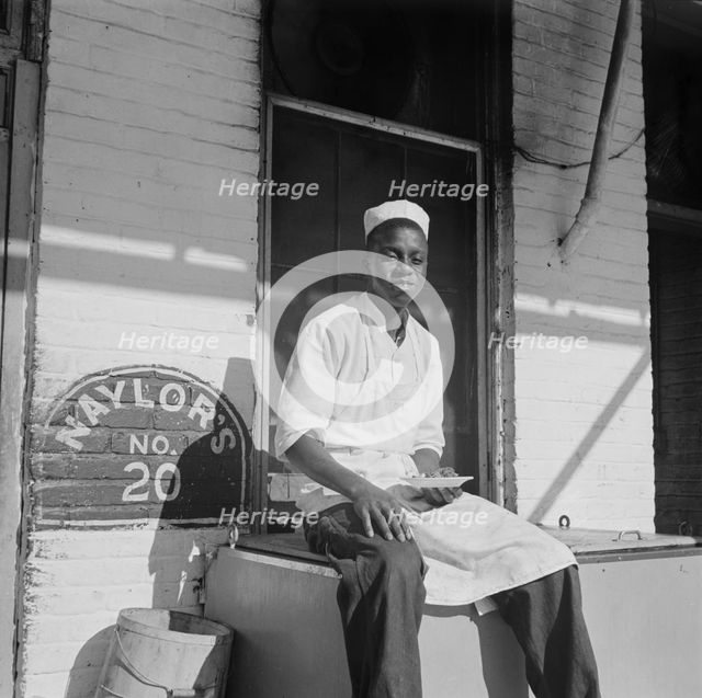 A dishwasher who works in a waterfront restaurant, Washington, D.C., 1942. Creator: Gordon Parks.