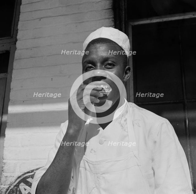 A dishwasher who works in a waterfront restaurant, Washington, D.C., 1942. Creator: Gordon Parks.