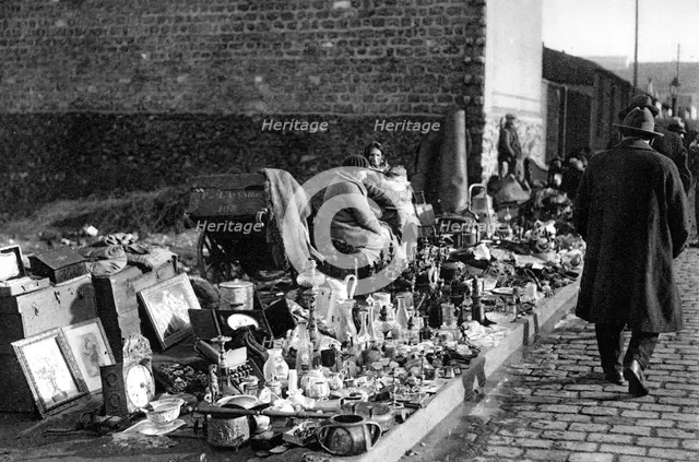 A display of goods at the flea market, Paris, 1931. Artist: Ernest Flammarion