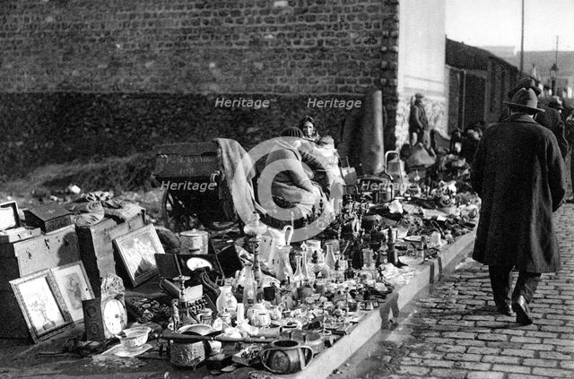 A display of goods at the flea market, Paris, 1931. Artist: Ernest Flammarion