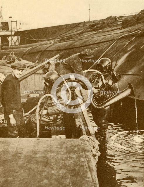 'A Diver With Euphonium and Swords from the German "Kaiser" Scuttled at Scapa', c1930. Creator: Unknown.
