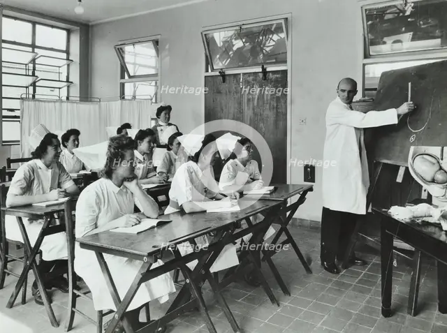 A doctor instructs trainee midwives, 1950s. Creator: Unknown.