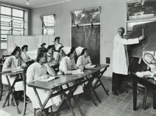 A doctor instructs trainee midwives, 1950s. Creator: Unknown