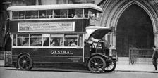A double-decker bus standing outside the Law Courts, London, 1926-1927