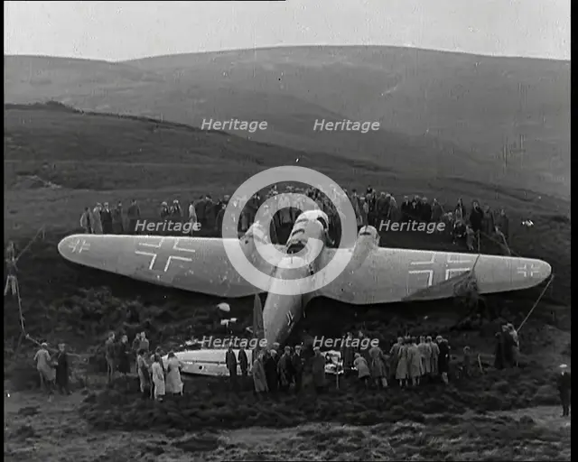 A Downed German Airforce Bomber Lying in a Scottish Field With a Rope Fence Around it and..., 1939. Creator: British Pathe Ltd.