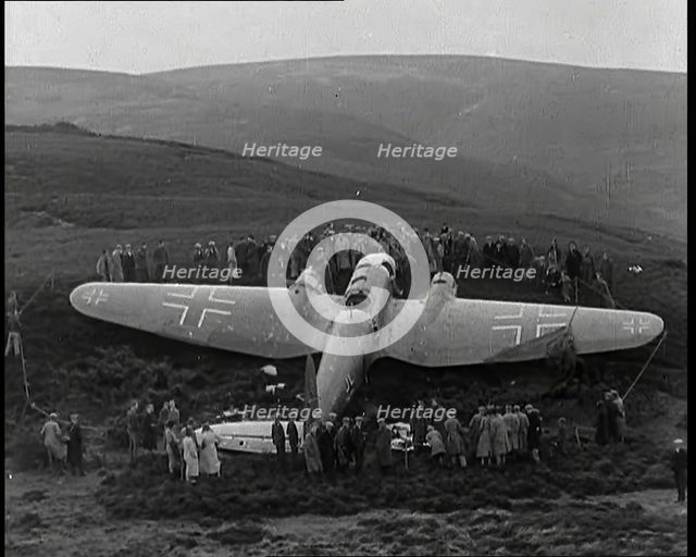 A Downed German Airforce Bomber Lying in a Scottish Field With a Rope Fence Around it and..., 1939. Creator: British Pathe Ltd.