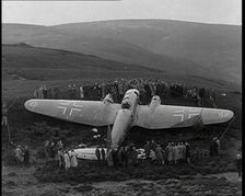 A Downed German Airforce Bomber Lying in a Scottish Field With a Rope Fence Around it and..., 1939. Creator: British Pathe Ltd