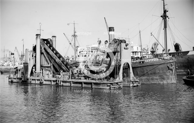 A dredger moored in Tilbury Docks, Essex, c1945-c1965. Artist: SW Rawlings