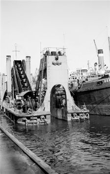 A dredger at work in Tilbury Docks, Essex, c1945-c1965. Artist: SW Rawlings