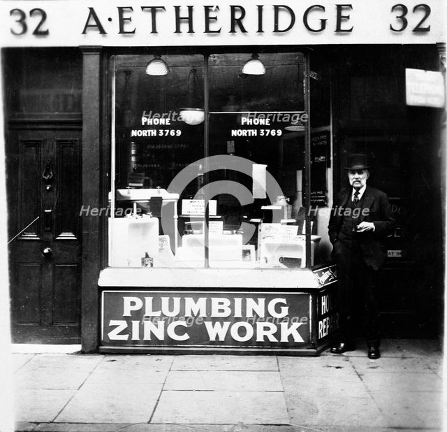 A Etheridge plumber's shop, possibly in Holloway Road, Islington, London, early 20th century. Creator: Henry Grant.