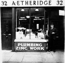 A Etheridge plumber's shop, possibly in Holloway Road, Islington, London, early 20th century. Creator: Henry Grant