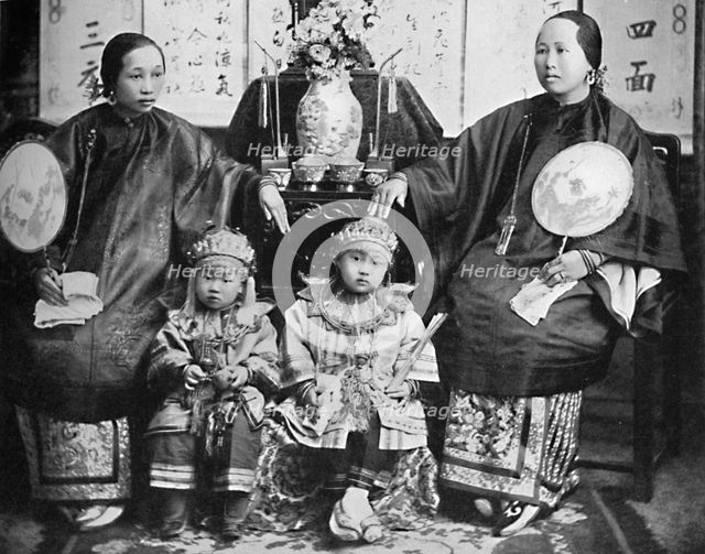 A family group of a prosperous Chinese merchant, 1902. Artist: CC Pierce & Co.