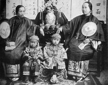 A family group of a prosperous Chinese merchant, 1902. Artist: CC Pierce & Co