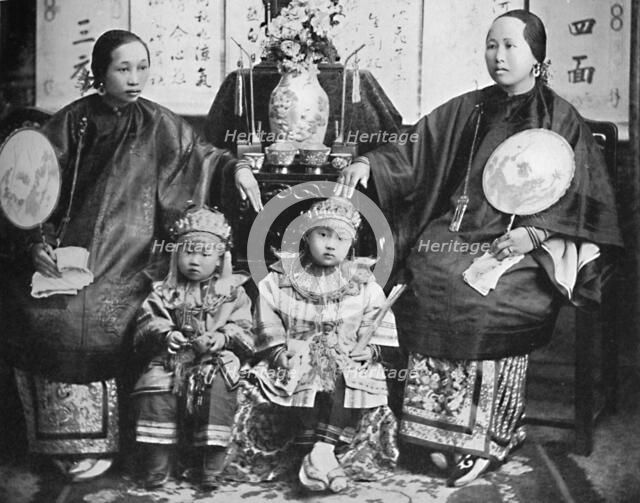 A family group of a prosperous Chinese merchant, 1902. Artist: CC Pierce & Co.