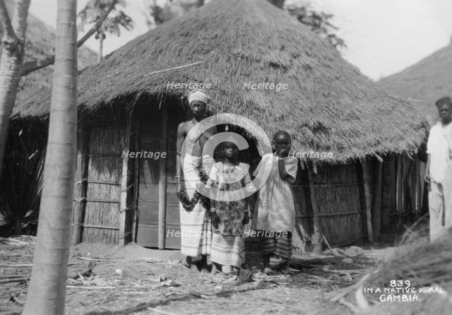 A family in front of their home, Gambia, 20th century. Artist: Unknown