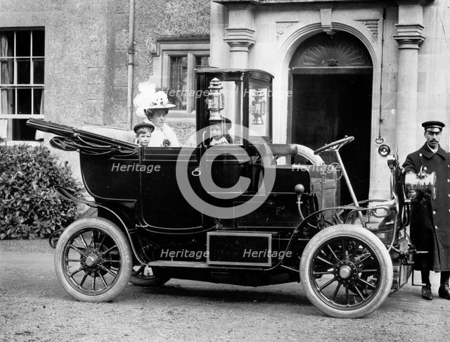 A family in their motor car with a chauffeur, c1860-c1922. Artist: Henry Taunt