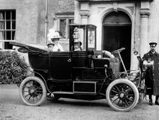 A family in their motor car with a chauffeur, c1860-c1922. Artist: Henry Taunt