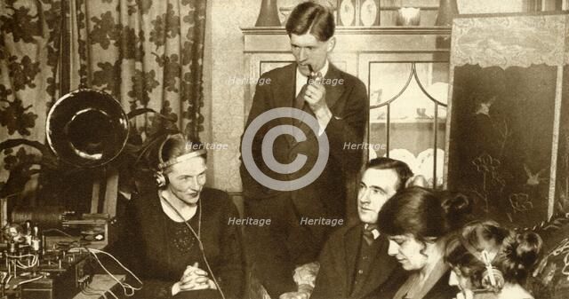 A family listening to the results of the general election of 1923, (1935).  Creator: Unknown.