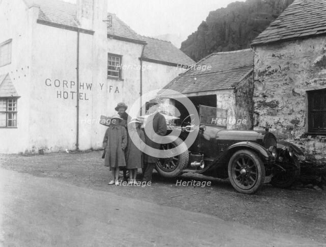 A family standing beside their car, Gorphwysfa Hotel, North Wales, c1920s-c1930s(?). Artist: Unknown