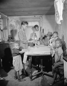 A family which lives in the Southwest area, Washington, D.C., 1942. Creator: Gordon Parks