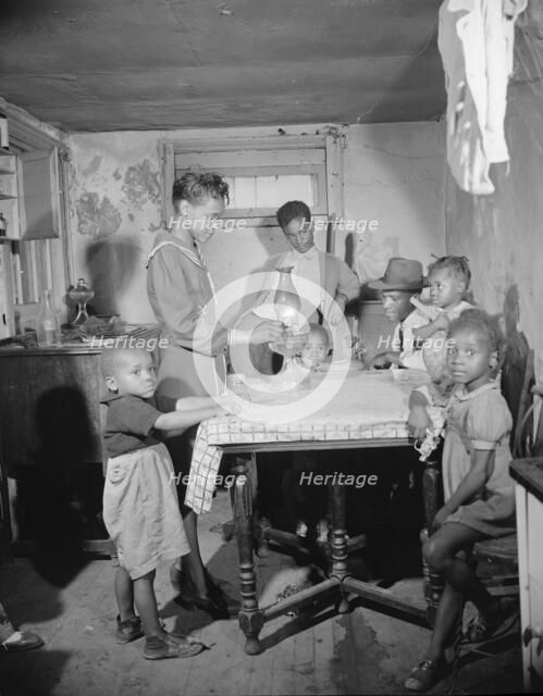 A family which lives in the Southwest area, Washington, D.C., 1942. Creator: Gordon Parks.