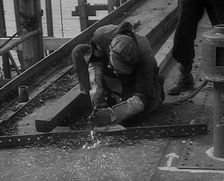 A Factory Worker Constructing Part of a Ship, 1943. Creator: British Pathe Ltd