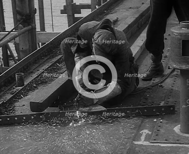 A Factory Worker Constructing Part of a Ship, 1943. Creator: British Pathe Ltd.