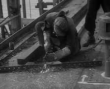 A Factory Worker Constructing Part of a Ship, 1943. Creator: British Pathe Ltd