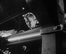 A Factory Worker Operating Machinery, 1943. Creator: British Pathe Ltd