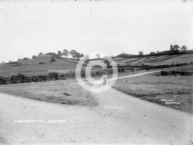 A farm labourer walking to work near Hellidon, Northamptonshire, c1873-c1923. Artist: Alfred Newton & Sons