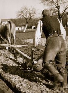 A farmer at work, ploughing a field, Germany, 1936. Creator: Unknown