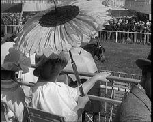 A Female Civilian Emerging from Behind a Sun Flower Shaped Parasol, 1920. Creator: British Pathe Ltd