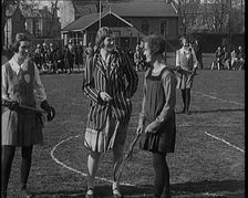 A Female Civilian Tossing a Coin in Front of Two Young Female Lacrosse Players Ahead of the..., 1920 Creator: British Pathe Ltd