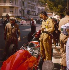 A Ferrari team member filling a car with fuel, Monaco Grand Prix, Monte Carlo, 1963