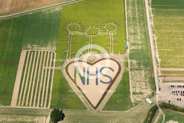A field with flowers planted in the shape of a heart in support of the NHS, Hayling Island, 2020. Creator: Damian Grady.