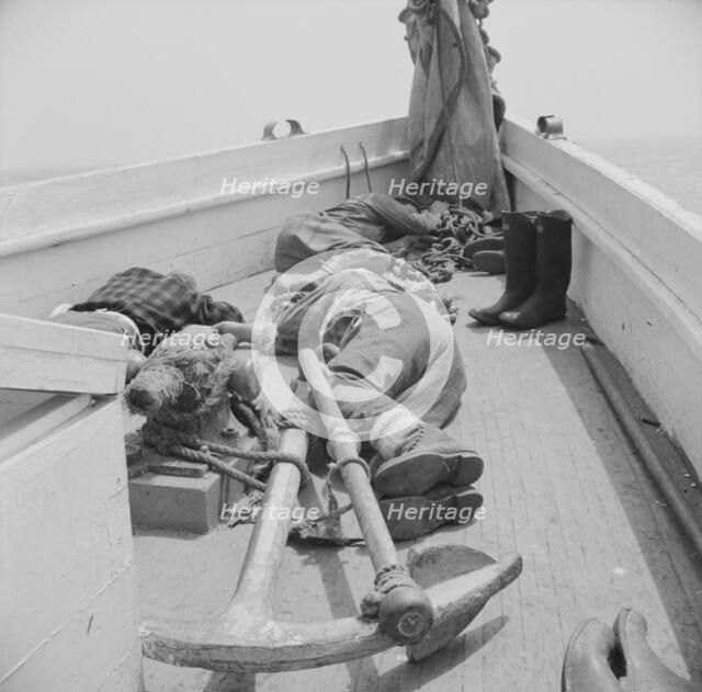 A fisherman's work is hard and many times they fall exhausted..., Gloucester, Massachusetts, 1943. Creator: Gordon Parks.